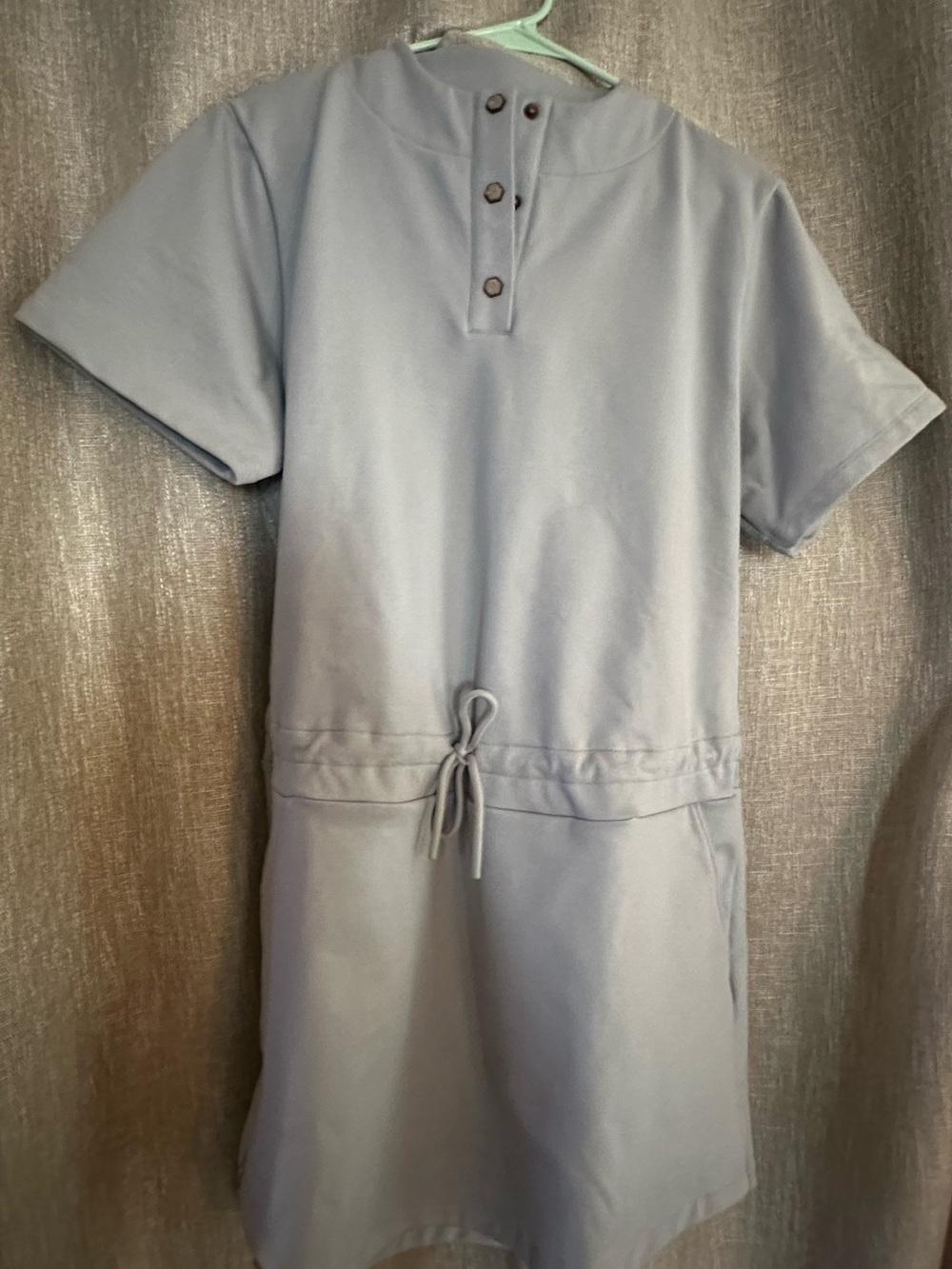 Swingdish grey dress with pockets and drawstring waist.